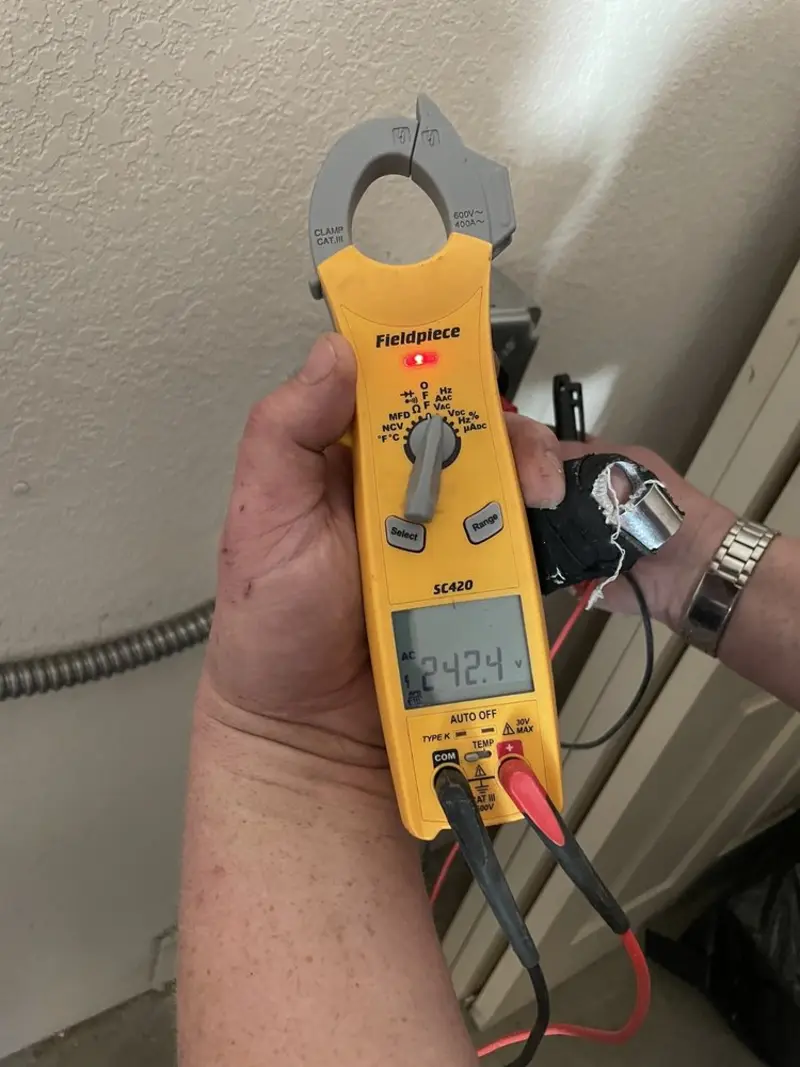 Voltage testing with clamp meter during Whole House Surge Protector in Sierra Vista Southeast